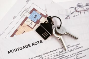 Mortgage documents and house keys illustrating real estate and estate planning after death